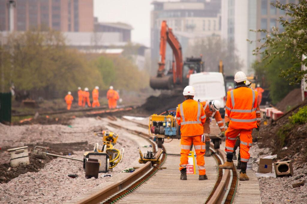 construction men on railway tracks