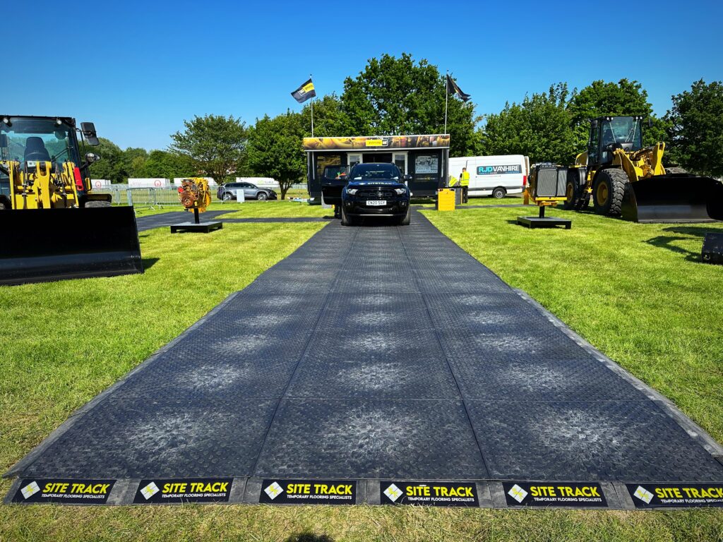 Site Track flooring with truck and contruction machines